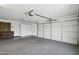 The garage features an automatic door opener, plenty of room for storage, and a workbench ready for projects at 10109 E Trailhead Ct, Gold Canyon, AZ 85118