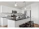 Modern kitchen with stainless appliances, breakfast bar and granite countertops at 10109 E Trailhead Ct, Gold Canyon, AZ 85118