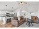 A cozy living room flows into the kitchen with a view to another living area at 10109 E Trailhead Ct, Gold Canyon, AZ 85118