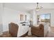 Living room is decorated with earth tones and features tile flooring at 10109 E Trailhead Ct, Gold Canyon, AZ 85118