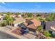Aerial shot of a well-maintained single-Gathering home with a tidy front yard, complementing the neighborhood's appeal at 10305 E Plata Ave, Mesa, AZ 85212