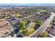 Overhead shot of a neighborhood with a playground, showcasing community amenities and well-maintained streets at 10305 E Plata Ave, Mesa, AZ 85212