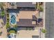 Aerial view of a home featuring a private pool and outdoor living space, creating a backyard oasis for relaxation at 10305 E Plata Ave, Mesa, AZ 85212
