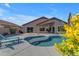 Beautiful backyard showcasing a pristine pool, lush foliage, and a relaxing lounge area at 10305 E Plata Ave, Mesa, AZ 85212