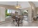 Charming dining area with a rustic table, backyard view, and easy access to the outdoor living space with the pool at 10305 E Plata Ave, Mesa, AZ 85212