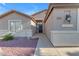 Close-up of the home's entrance showing the front door and desert landscaping at 10305 E Plata Ave, Mesa, AZ 85212