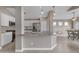 Open kitchen with a large island, granite countertops, and stainless steel appliances at 10305 E Plata Ave, Mesa, AZ 85212
