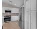 Modern kitchen with stainless steel appliances, white cabinets, and a gas range stove at 10305 E Plata Ave, Mesa, AZ 85212