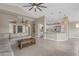Open-concept living space featuring tile flooring, high ceilings, and a view into the kitchen at 10305 E Plata Ave, Mesa, AZ 85212