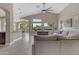 Inviting living room with backyard view, features neutral walls, tile floors, and an open-concept layout to kitchen at 10305 E Plata Ave, Mesa, AZ 85212