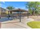 Community park featuring a shaded picnic area, tables and benches, perfect for Gathering gatherings at 10305 E Plata Ave, Mesa, AZ 85212