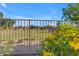 Community park showcasing green space and yellow trumpet flowers at 10305 E Plata Ave, Mesa, AZ 85212