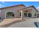 Covered patio featuring ample seating areas, with an adjacent pool for outdoor relaxation at 10305 E Plata Ave, Mesa, AZ 85212