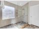This is a glass-enclosed shower featuring sleek tile work and a built-in shelf for added convenience at 10305 E Plata Ave, Mesa, AZ 85212