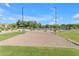 Community sand volleyball court with well-maintained nets and surrounding landscaping, perfect for recreational play at 10305 E Plata Ave, Mesa, AZ 85212