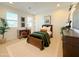 Bedroom with natural light from shuttered windows, a desk, and a bed for a comfortable retreat at 10344 E Trillium Ave, Mesa, AZ 85212