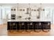 Modern kitchen with a large island, pendant lights, and seating for four at 10344 E Trillium Ave, Mesa, AZ 85212