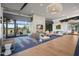 Luxurious lounge area with a cozy fireplace, comfortable seating, and stylish decor at 10344 E Trillium Ave, Mesa, AZ 85212