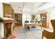 Bright office featuring built-in bookshelves, a wooden desk, and a chandelier at 10344 E Trillium Ave, Mesa, AZ 85212