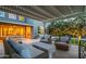 Inviting outdoor living space with comfortable seating, a stylish coffee table, and ample room for entertaining at 10344 E Trillium Ave, Mesa, AZ 85212
