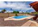 The private backyard pool, complete with palm trees, offers a tranquil escape for leisure and recreation at 1062 E Watson Dr, Tempe, AZ 85283