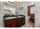 Well-lit bathroom boasts a double sink vanity with great counter space and a separate toilet room at 1062 E Watson Dr, Tempe, AZ 85283