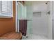 This bathroom features a stunning glass-enclosed shower with white subway tile and a built-in niche at 1062 E Watson Dr, Tempe, AZ 85283