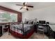 Bedroom with a ceiling fan, window, and a dark metal bed frame with gray bedding at 1062 E Watson Dr, Tempe, AZ 85283