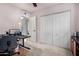Bedroom featuring a closet, ceiling fan, desk, and carpeted floors at 1062 E Watson Dr, Tempe, AZ 85283