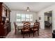 A dining room with a dark wood china cabinet, and a table with seating for six guests at 1062 E Watson Dr, Tempe, AZ 85283