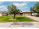 Charming single-story brick home featuring a well-maintained lawn and an attached two-car garage at 1062 E Watson Dr, Tempe, AZ 85283