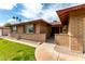 Inviting entrance of a single-story brick home featuring desert landscaping and a covered entryway at 1062 E Watson Dr, Tempe, AZ 85283