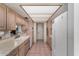 Efficient kitchen with classic cabinets, tiled countertops, and modern appliances for easy meal prep at 1062 E Watson Dr, Tempe, AZ 85283