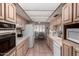 Kitchen features tile countertops and a stainless-steel oven at 1062 E Watson Dr, Tempe, AZ 85283
