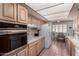 Kitchen features tile countertops, a stainless-steel oven, and open access to dining area at 1062 E Watson Dr, Tempe, AZ 85283