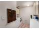 Functional laundry room with tile flooring, built-in cabinetry, and included washer and dryer at 1062 E Watson Dr, Tempe, AZ 85283