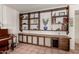 Built in shelving with a wood-look accent wall at 1062 E Watson Dr, Tempe, AZ 85283