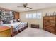 Spacious main bedroom features a ceiling fan, and shuttered windows for great natural lighting at 1062 E Watson Dr, Tempe, AZ 85283
