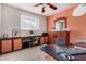 This office features a dark desk and a window for plenty of natural light at 1062 E Watson Dr, Tempe, AZ 85283