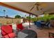 Outdoor patio features stylish seating, ceiling fans, and a peaceful spot for entertaining at 1062 E Watson Dr, Tempe, AZ 85283