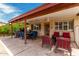 Spacious covered patio with a ceiling fan offers the perfect setting for outdoor relaxation and dining at 1062 E Watson Dr, Tempe, AZ 85283