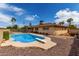 Backyard features a refreshing private pool with diving board and well maintained landscaping at 1062 E Watson Dr, Tempe, AZ 85283