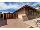 Side yard features wooden gate to the backyard and easy access to the house at 1062 E Watson Dr, Tempe, AZ 85283