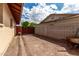 Wide side yard features a wooden gate, block fence, and plenty of room for storage at 1062 E Watson Dr, Tempe, AZ 85283