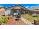 A well-maintained backyard featuring a covered patio, lush lawn, and mature landscaping, perfect for outdoor living and entertaining at 10755 W Mountain View Dr, Avondale, AZ 85323