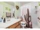 Bathroom with a vanity sink and a shower with a cactus curtain at 10755 W Mountain View Dr, Avondale, AZ 85323