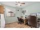 Bedroom with two desks, two chairs, hardwood floors, and a window at 10755 W Mountain View Dr, Avondale, AZ 85323