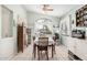 Cozy dining room featuring tile floors, ceiling fan, and ample natural light at 10755 W Mountain View Dr, Avondale, AZ 85323