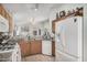 Functional kitchen with granite countertops, gas range, and white appliances at 10755 W Mountain View Dr, Avondale, AZ 85323