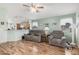 Inviting living room showcasing laminate floors, comfortable seating, and natural light at 10755 W Mountain View Dr, Avondale, AZ 85323